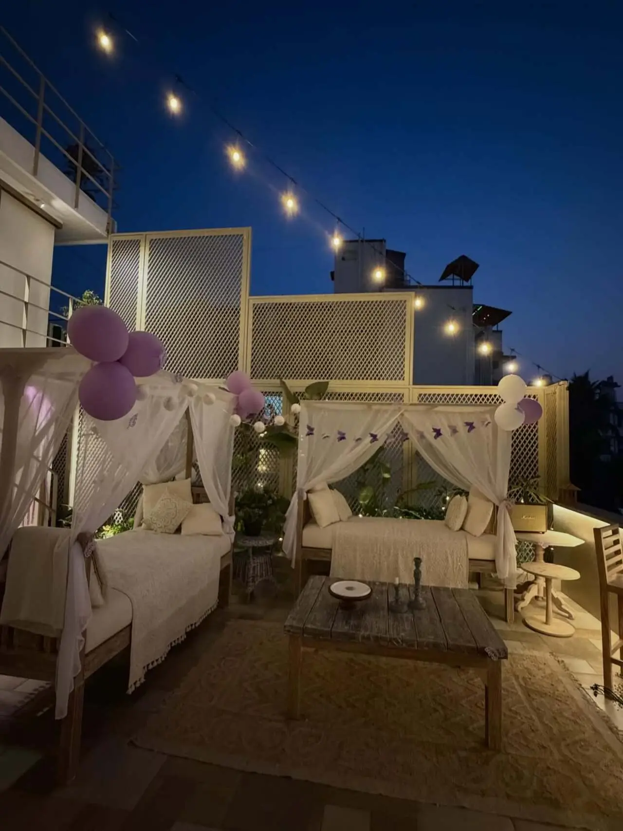 The overall ambiance feels elegant, minimal, and perfect for a private celebration. The place was decorated with sheer white curtains, fairy light, and lavender balloons.